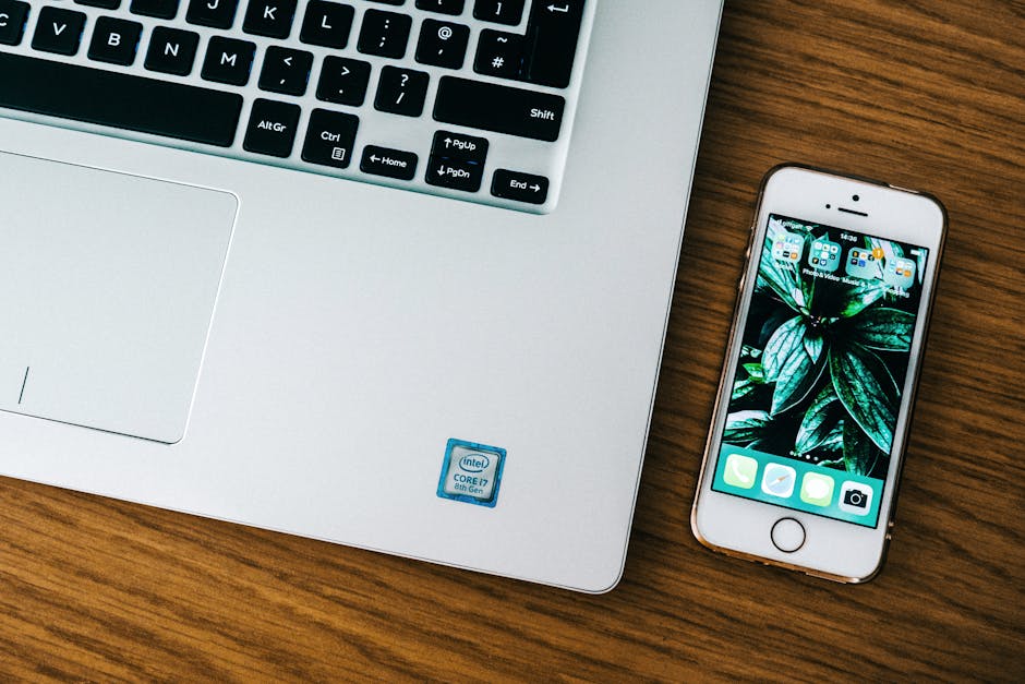 Laptop and iPhone on desk